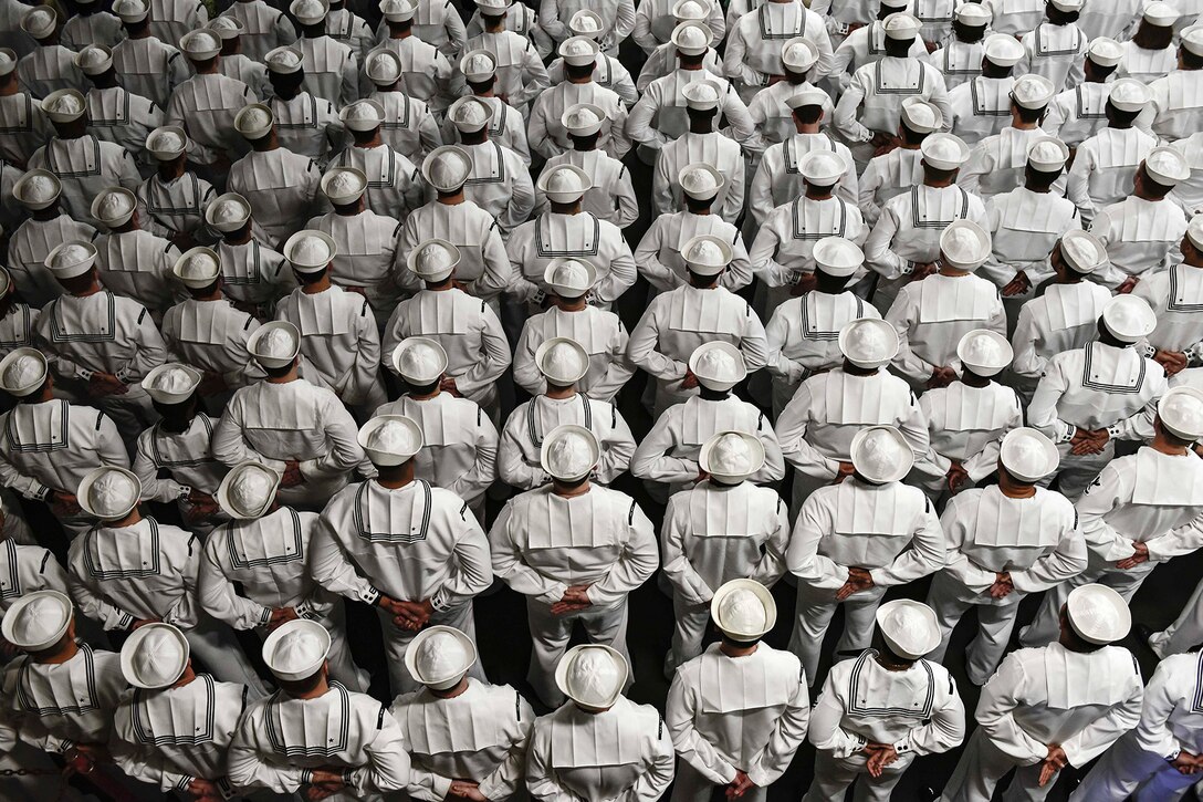 Sailors stand during a change-of-command ceremony.