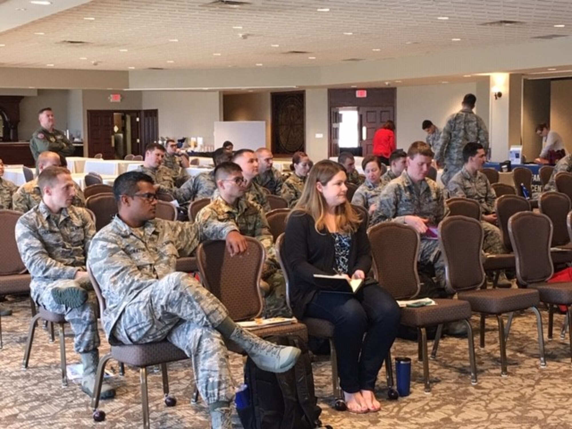 Active duty members and civilian employees actively listen to a variety of briefers and take notes during the Wright Start information program.  Briefers educate the audience about what the 88th Air Base Wing and tenant units on base have to offer.  (U.S. Air Force photo/Kimberly Gaither)