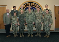 U.S. Navy Vice Adm. David Kriete, U.S. Strategic Command deputy commander, poses for a photo with U.S. Army Command and General Staff College (CGSC) Art of War Scholars during their visit to USSTRATCOM Headquarters at Offutt Air Force Base, Neb., April 16, 2019. During their visit, scholars received briefings about nuclear history, intelligence, planning and deterrence. The visit is part of USSTRATCOM's ongoing to engage with up and coming leaders about the nuclear enterprise. (Photo by Steve Cunningham)