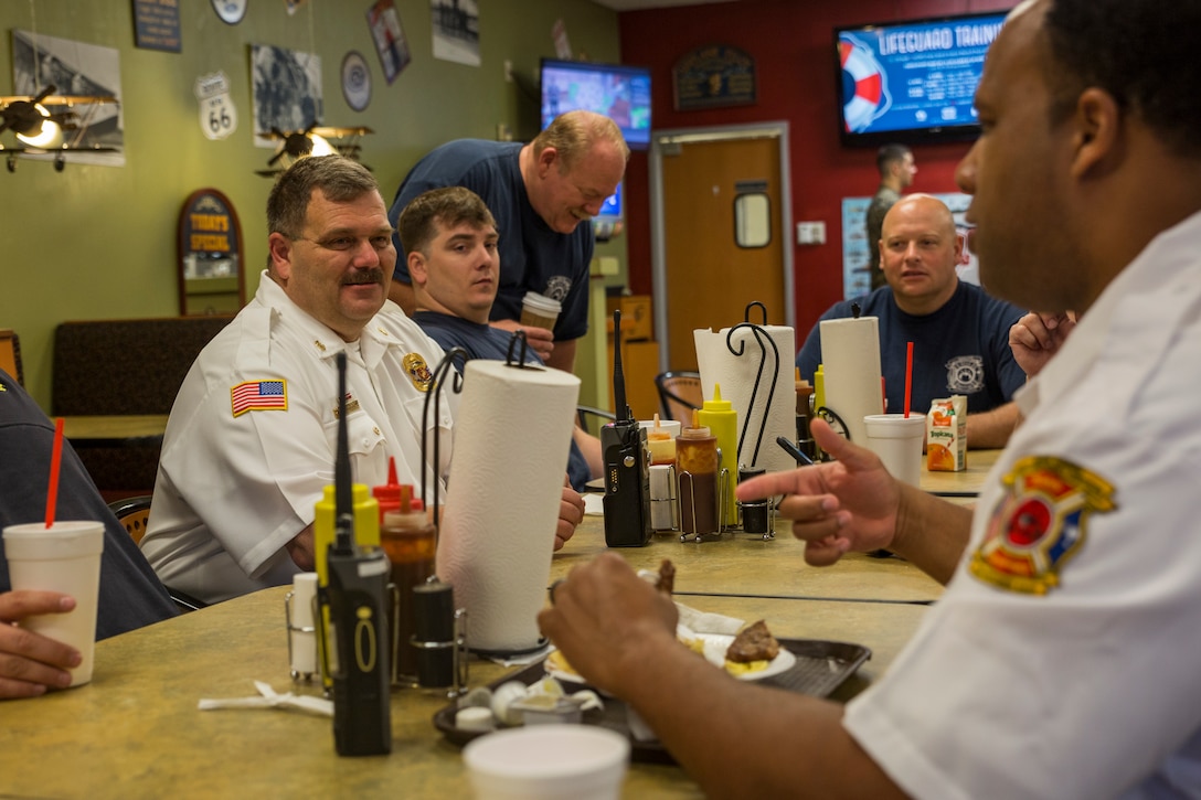 Fire Chief Darran Vaughn has breakfast at Hangar One with his firefighters and emergency services personnel aboard Marine Corps Air Station Beaufort, April 5. For the firefighters on this shift they have family breakfast and family dinner on Fridays to foster camaraderie.