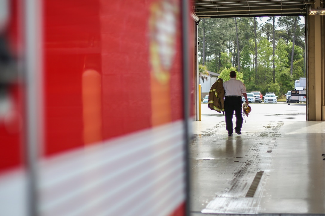 Fire Chief Darran Vaughn returns his firefighting gear to his truck aboard MCAS Beaufort, April 5. Within the next two years Vaughn is slated to retire after 23 years of service to MCAS Beaufort and nearly 39 total years of firefighting.