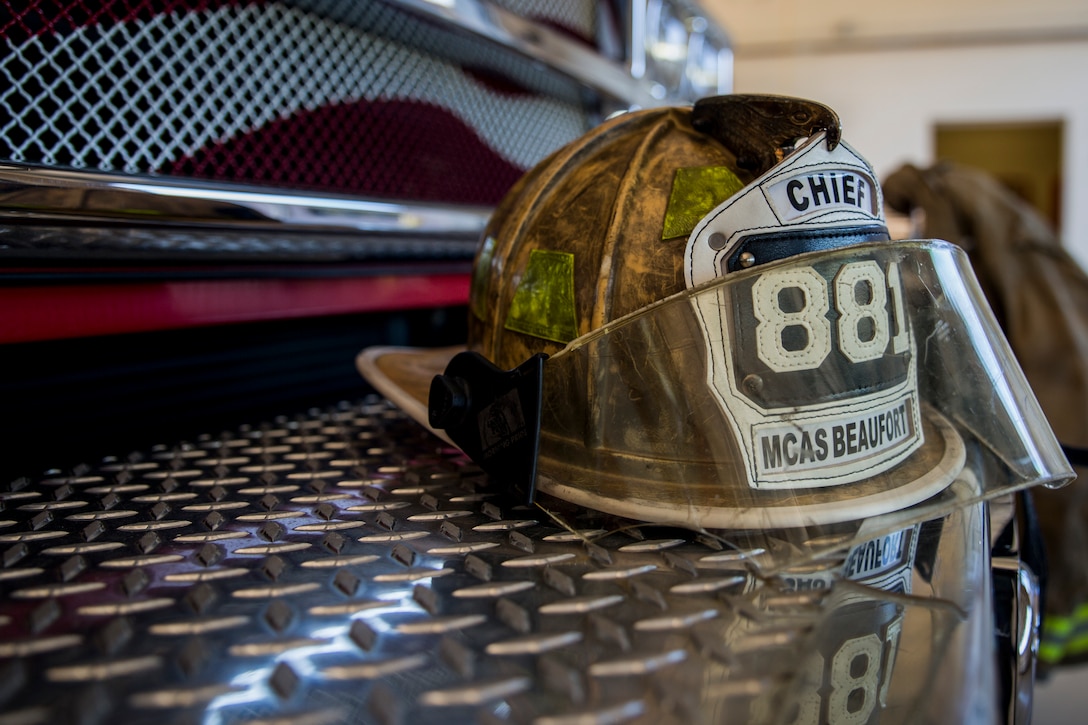 Fire Chief Darran Vaughn’s firefighting gear sits on the front of Ladder 88 aboard Marine Corps Air Station Beaufort April 16. Vaughn has been firefighting since he was 16 years old, both as a volunteer firefighter, a Marine, and as a paid firefighter. Vaughn is slated to retire from MCAS Beaufort within the next 2 years.