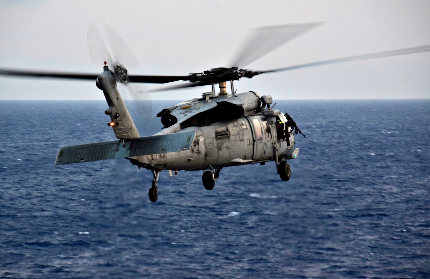 Official U.S. Navy file photo of an MH-60S Sea Hawk helicopter, assigned to the "Island Knights" of Helicopter Sea Combat Squadron (HSC) 25.