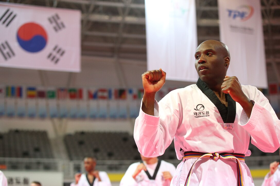 Antwaun Parrish, an U.S. Army Corps of Engineers, Far East District public affairs specialist, conducts Taekwondo training during a cultural exchange event hosted by The Republic of Korea (ROK), Ministry of National Defense at Taekwondowon, Muju, South Korea, April 9-11.