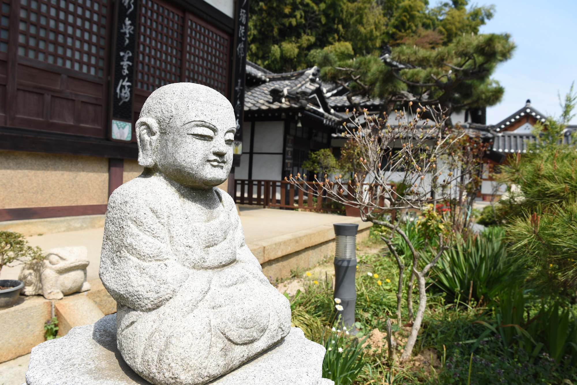 A Buddha statue rests on a pillar outside of Daeungjeon Hall of Dongguksa Temple in Gunsan City, Republic of Korea, April 13, 2019. The Dongguksa Temple was built as a temple of the Soto sect of Japanese Buddhism. (U.S. Air Force photo by Staff Sgt. Joshua Edwards)