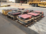 Contractors prepare to transport more than 14,000 pounds of lead acid batteries from Thumrait Air Base to a recycling facility in Oman.