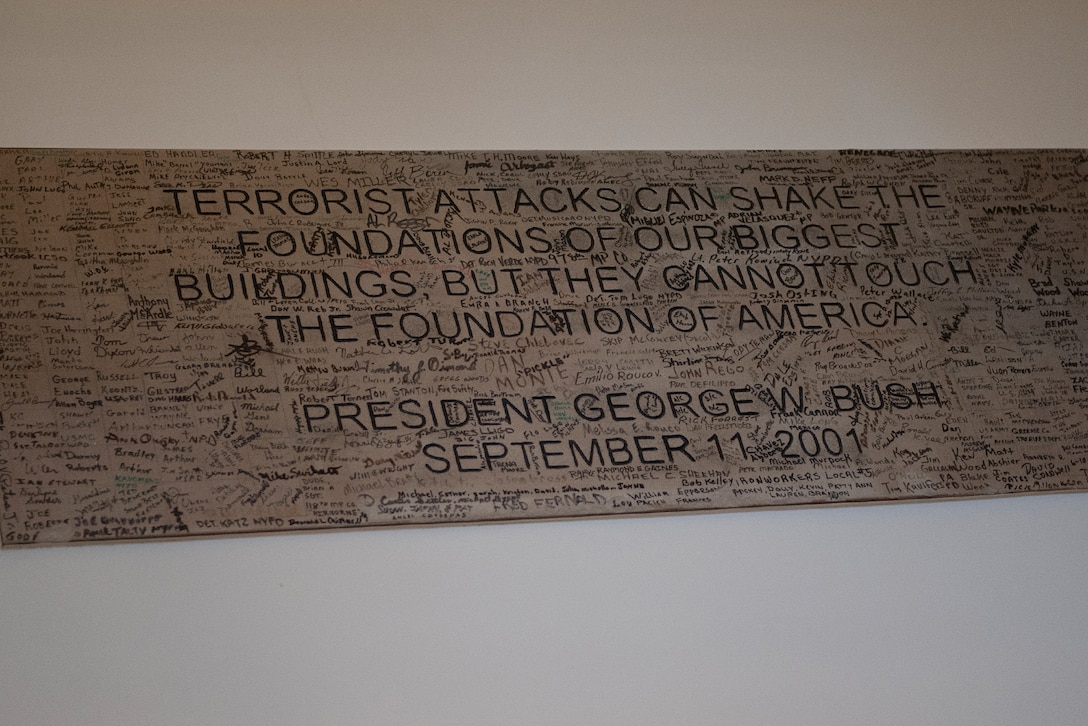 A plaque with an inspirational quote is surrounded by signatures.
