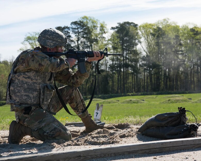 U.S. Army Spc. Jacob A. Hartman, military police Soldier, 221st military police detachment with the U.S. Army Training and Doctrine Command, fires his rifle down range in Fort Eustis’ Range 3 at Joint Base Langley-Eustis, Virginia, April 10, 2019. Soldiers during this portion of the competition had to fire their weapon from prone, kneeling, and standing positions. (U.S. Air Force Photo by Airman 1st Class Marcus M. Bullock)