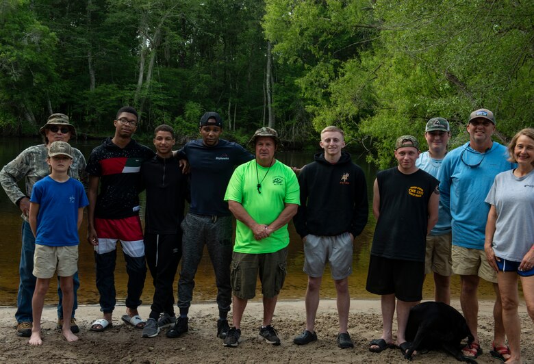 U.S. Airmen pose with kayaking instructors for an 8-mile kayaking trip, Ridgeville, S.C., April 13, 2019.