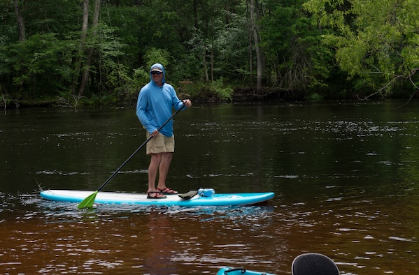 Earl Johnston, kayaking instructor, paddle boards on Black River near, Ridgeville, S.C., April 13, 2019.