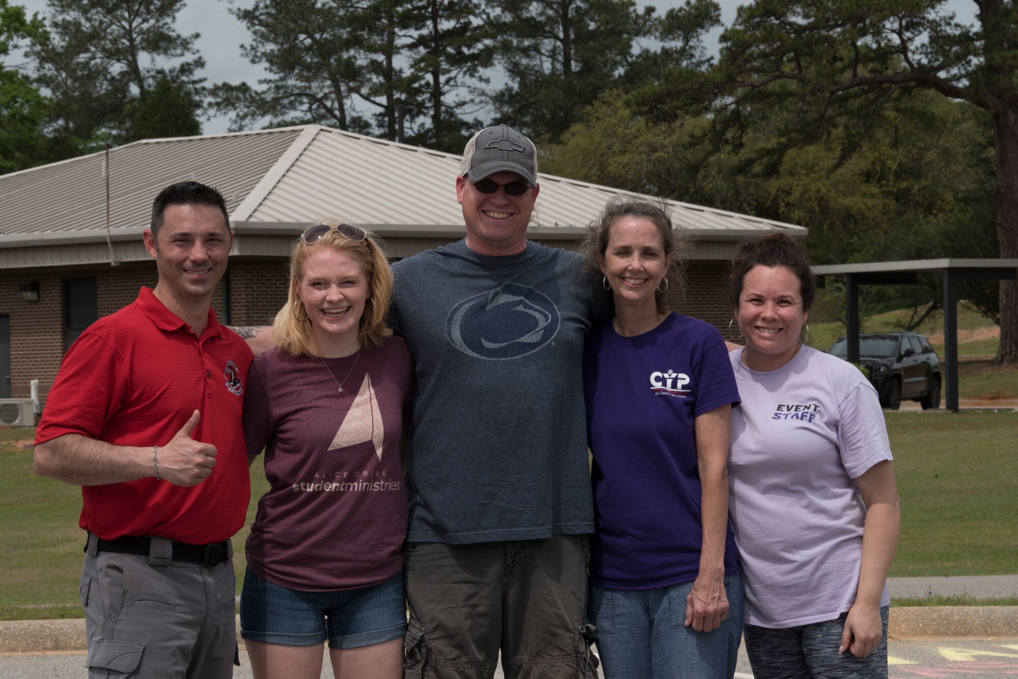 Julie A. Lego, Youth of the Year recipient, poses for a photo with her family and 20th Force Support Squadron leadership on Shaw Air Force Base, SC, April 13, 2019.