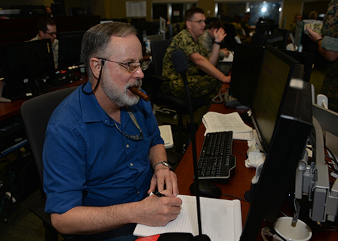 Chief Warrant Officer Alice Martinez, USCG, stands a watch during exercise Integrated Advance 2019 at their U.S. Southern Command headquarters in Miami, Florida.