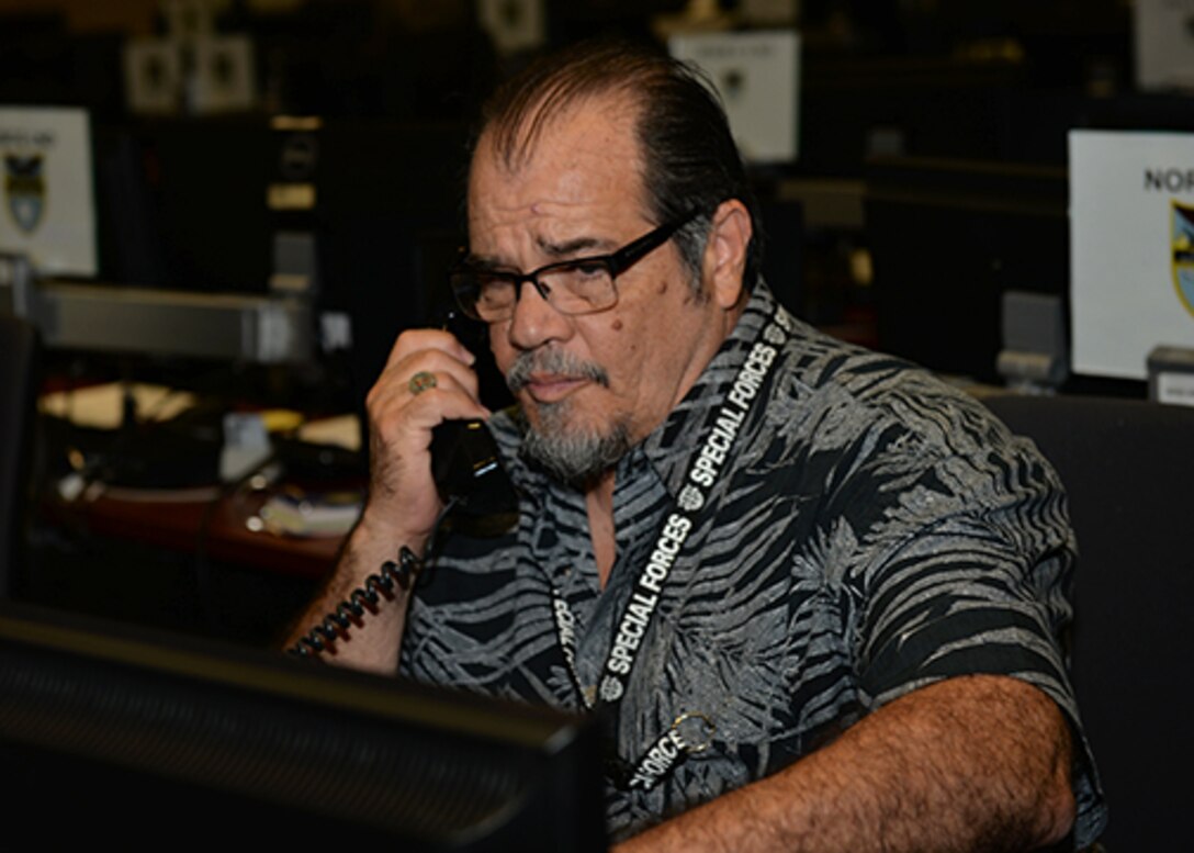 Luis Rivera, a member of U.S. Southern Command’s Operations Directorate, at work during exercise Integrated Advance 2019 at their U.S. Southern Command headquarters in Miami, Florida.