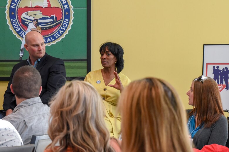 Jacqueline Coleman, senior vice president, broadcasting and game presentation for the Washington Nationals (center), discusses leadership challenges with incoming Air Force District of Washington commanders and their spouses during a leadership panel at Nationals Park, Washington, Aug. 16. The panel is part of AFDW's week-long Squadron Commanders and Spouses  Course. (U.S. Air Force photo by 2nd Lt. Jessica Cicchetto)