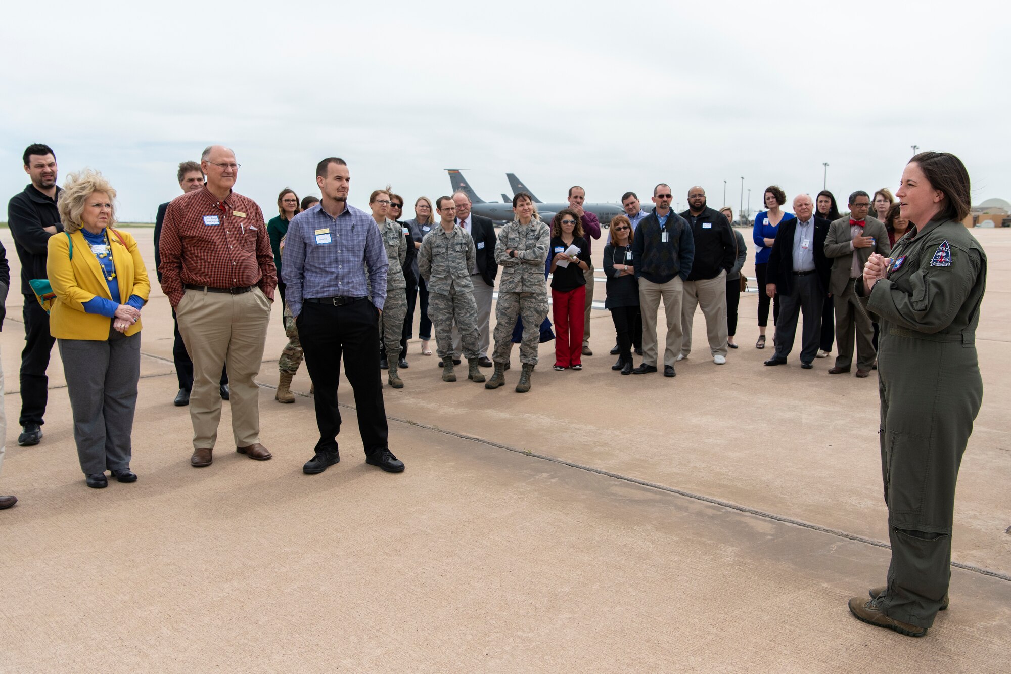 U.S. Air Force boom operator prepares group to tour KC-135 Stratotanker.