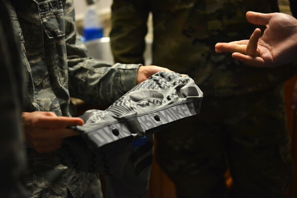A Beale Airman gets to hold a pair of biometric measuring compression shorts that can assist with the health and stress of the wearer.