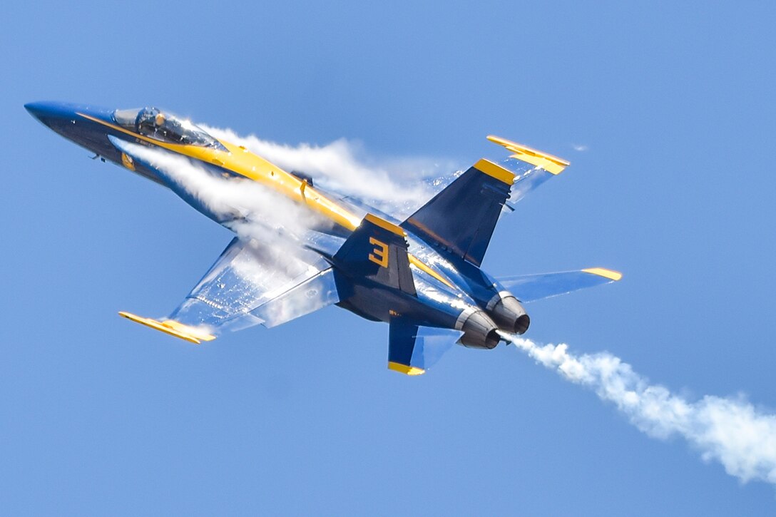 A pilot performs a maneuver in an aircraft.