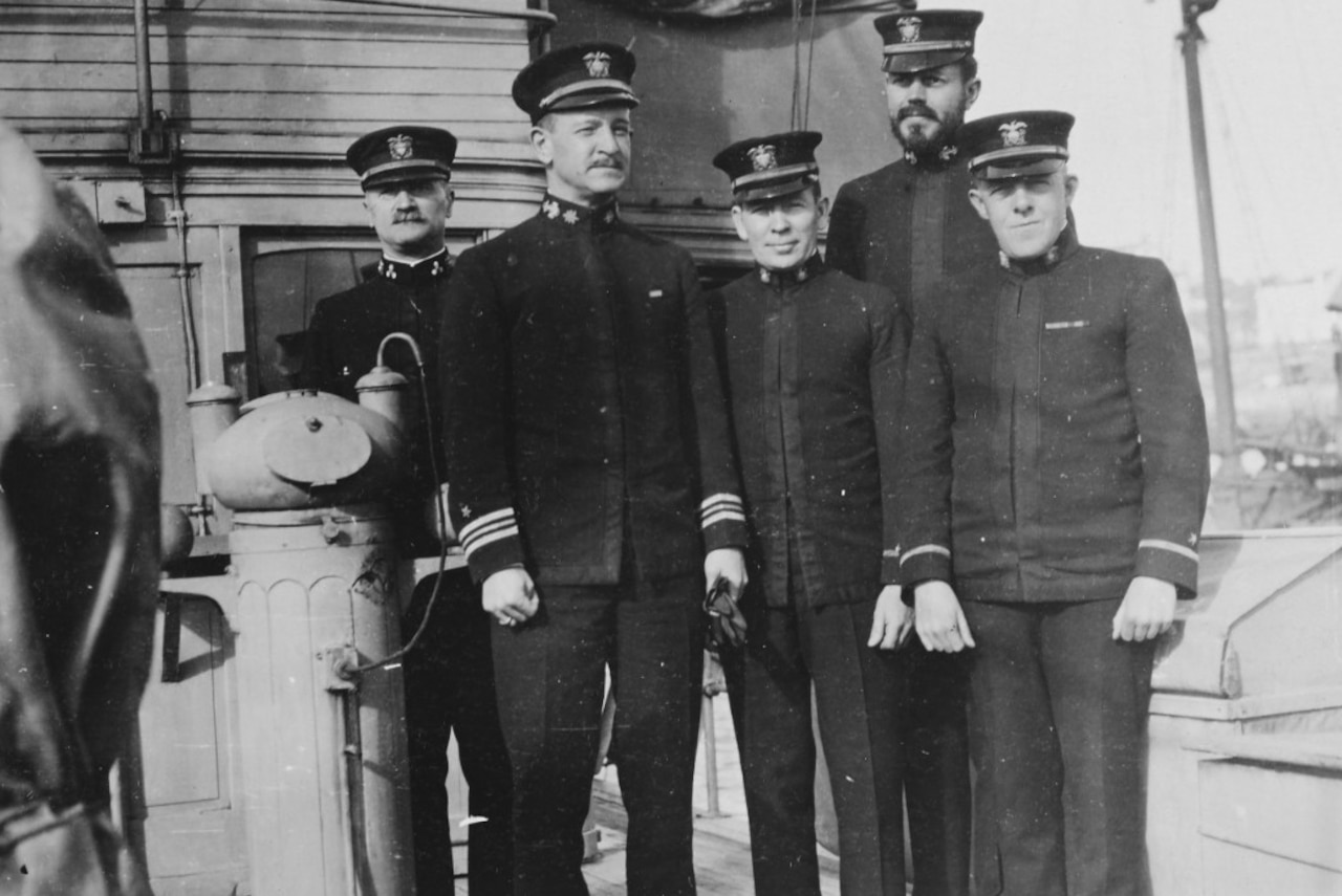 USS Margaret officers stand by the ship’s binnacle. Officers include Navy Lt. Cmdr. Frank Jack Fletcher.