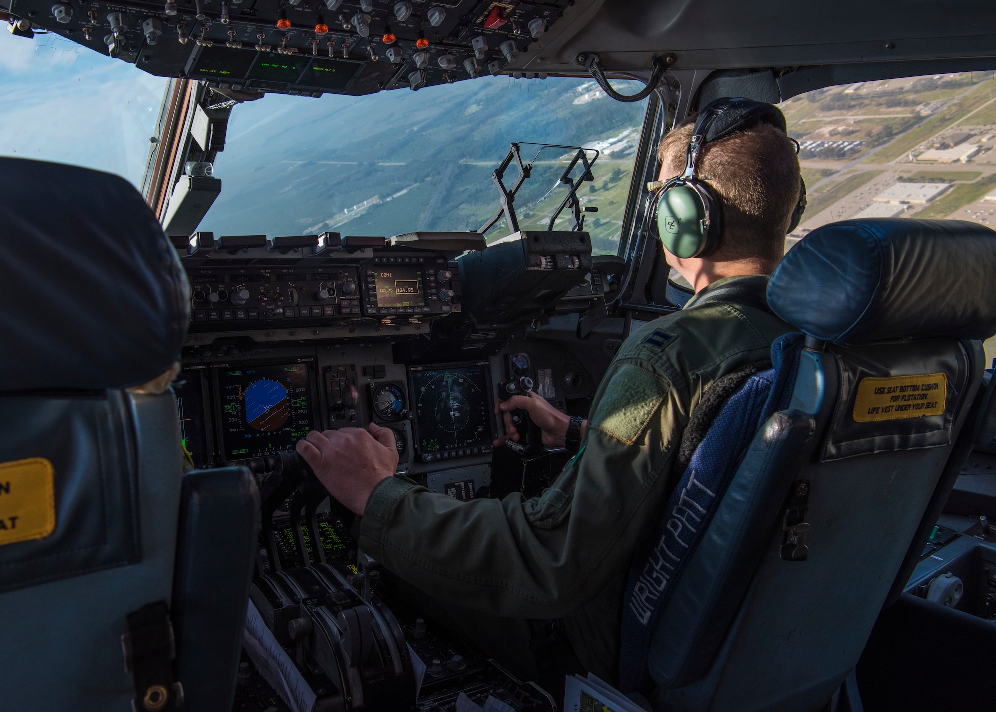 Capt. Jeremiah Brown, 89th Airlift Squadron pilot, operates a C-17 Globemaster III, assigned to Wright-Patterson Air Force Base, Ohio, during Exercise Patriot Hook 2019, April 11, 2019, at Vandenberg Air Force Base, Calif. The C-17 is the most flexible cargo aircraft to enter the airlift force and is capable of rapid strategic delivery of troops and cargo to main operating bases or directly to forward bases. (U.S. Air Force photo by Airman 1st Class Aubree Milks)