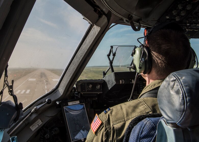 Capt. Jeffrey Anderson, 89th Airlift Squadron pilot, prepares to land a C-17 Globemaster III, assigned to Wright-Patterson Air Force Base, Ohio, during exercise Patriot Hook 2019, April 11, 2019 at Vandenberg Air Force Base, Calif. The C-17 is capable of rapid strategic delivery of troops and cargo to main operating bases or directly to forward bases, which was an essential training requirement during the exercise. (U.S. Air Force photo by Airman 1st Class Aubree Milks)