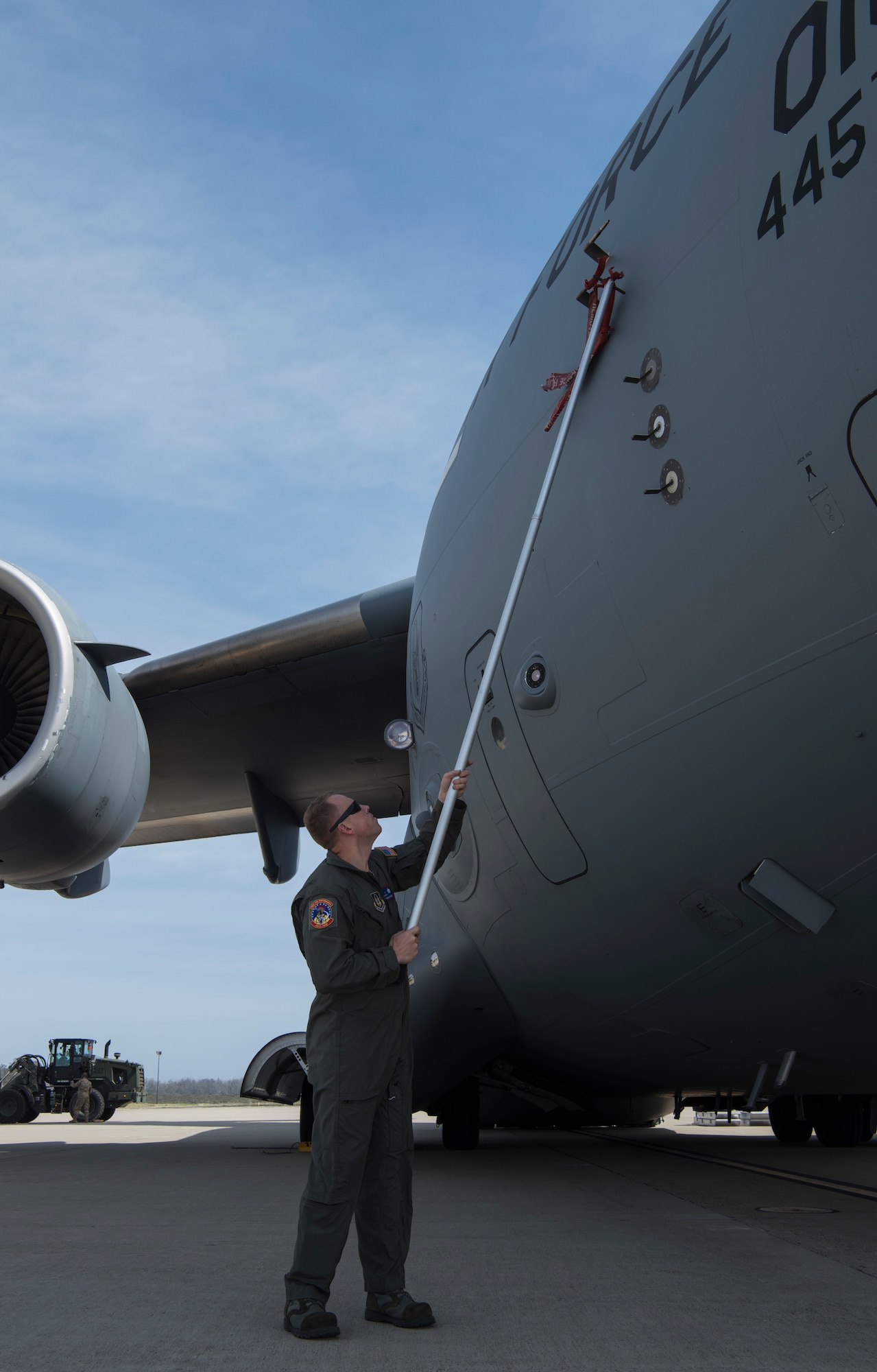 Tech. Sgt. Michael Mahaney, 445th Aircraft Maintenance Squadron hydraulic chief, removes pitot-static covers from a C-17 Globemaster III, assigned to Wright-Patterson Air Force Base, Ohio, during exercise Patriot Hook 2019, April 11, 2019, at Vandenberg Air Force Base, Calif. A pitot-static system is a pressure-sensitive instruments that is used in aviation to determine an aircraft's airspeed, altitude and altitude trend. The aircraft was required as the members simulated the real-world contingency exercise. (U.S. Air Force photo by Airman 1st Class Aubree Milks)