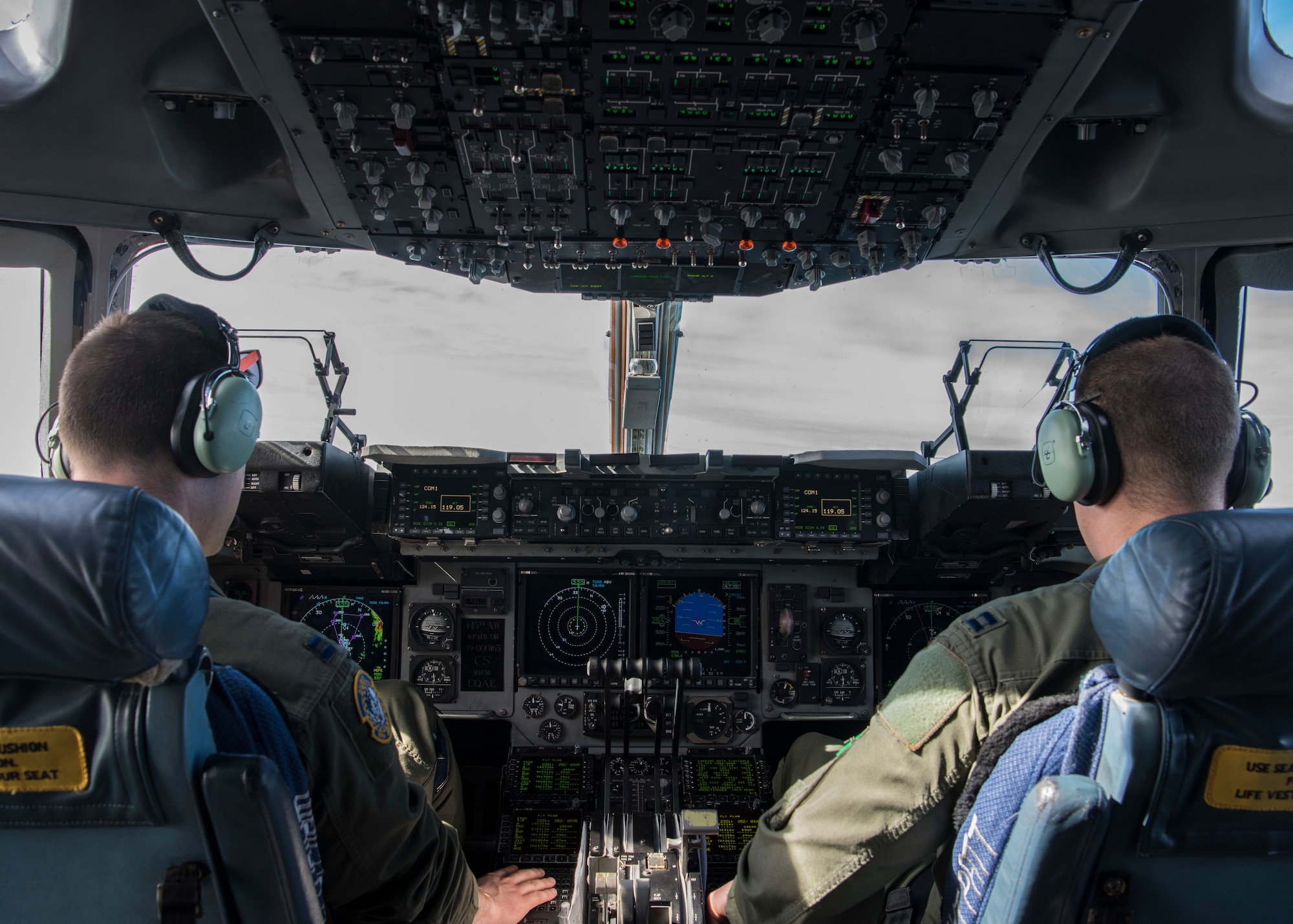 Capt. Jeffrey Anderson and Capt. Jeremiah Brown, 89th Airlift Squadron pilots, operate a C-17 Globemaster III, assigned to Wright-Patterson Air Force Base, Ohio, during exercise Patriot Hook 2019, April 11, 2019, at Vandenberg Air Force Base, Calif. The C-17 is operated by a three-man crew, consisting of a pilot, co-pilot and loadmaster to reduce manpower requirements, risk exposure and long-term operating costs. (U.S. Air Force photo by Airman 1st Class Aubree Milks)