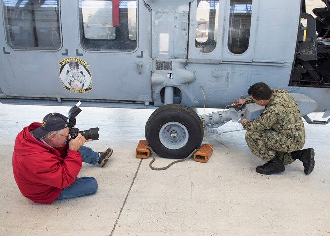 Eddie Green, NSWC PCD Lynxnet contract photographer, shoots photos of a Sailor for a feature article for the Coastal Compass, NSWC PCD’s magazine. He is passionate about the mission here because it improves the lethality of the fleet.