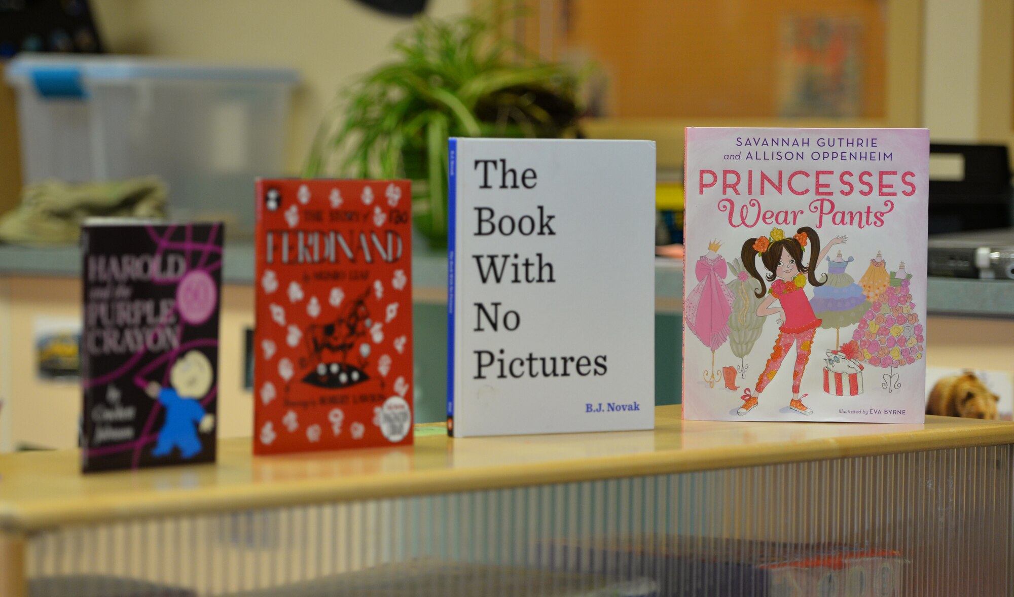 The Denali Child Development Center displays a selection of books for its guests to choose from during their visit, Joint Base Elmendorf-Richardson, Alaska, April 8, 2019. In honor of Month of the Military Child, U.S. Air Force Col. Patricia Csànk, JBER and 673d Air Base Wing commander, visited the CDC to read to some of the children. Out of the selection of four books, the kids elected to read “The Book With No Pictures,” by B.J. Novak, knowing all too well what this piece of literature would have Csànk reading aloud.