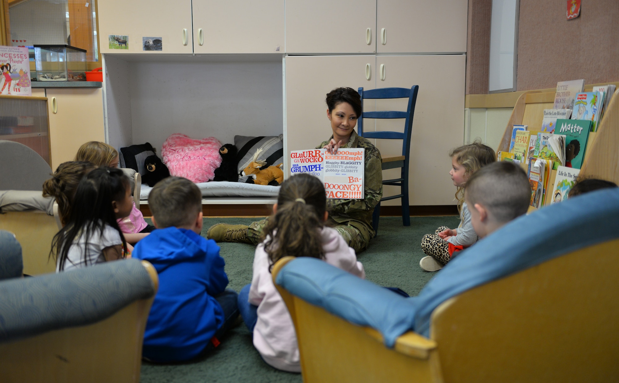 In honor of The Month of the Military Child, U.S. Air Force Col. Patricia Csànk, Joint Base Elmendorf-Richardson and 673d Air Base Wing commander, visited the Denali Child Development Center to read to some of the children, JBER, Alaska, April 8, 2019. Out of the selection of four books, the kids elected to read “The Book With No Pictures,” by B.J. Novak, knowing all too well what this piece of literature would have Csànk reading aloud.