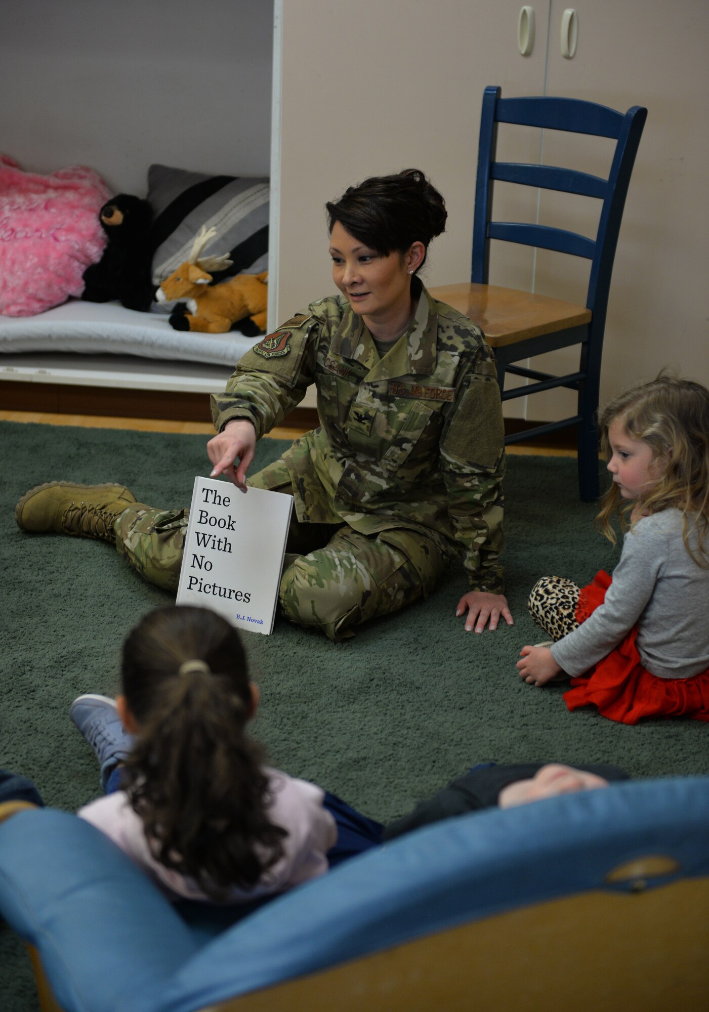 U.S. Air Force Col. Patricia Csànk, Joint Base Elmendorf-Richardson and 673d Air Base Wing commander, interacts with kids at the Denali Child Development Center, JBER, Alaska, April 8, 2019. In honor of Month of the Military Child, Csànk visited the Denali Child Development Center at JBER to read to some of the children. Out the selection of four books, the kids elected to read “The Book With No Pictures,” by B.J. Novak, knowing all too well what this piece of literature would have Csànk reading aloud.