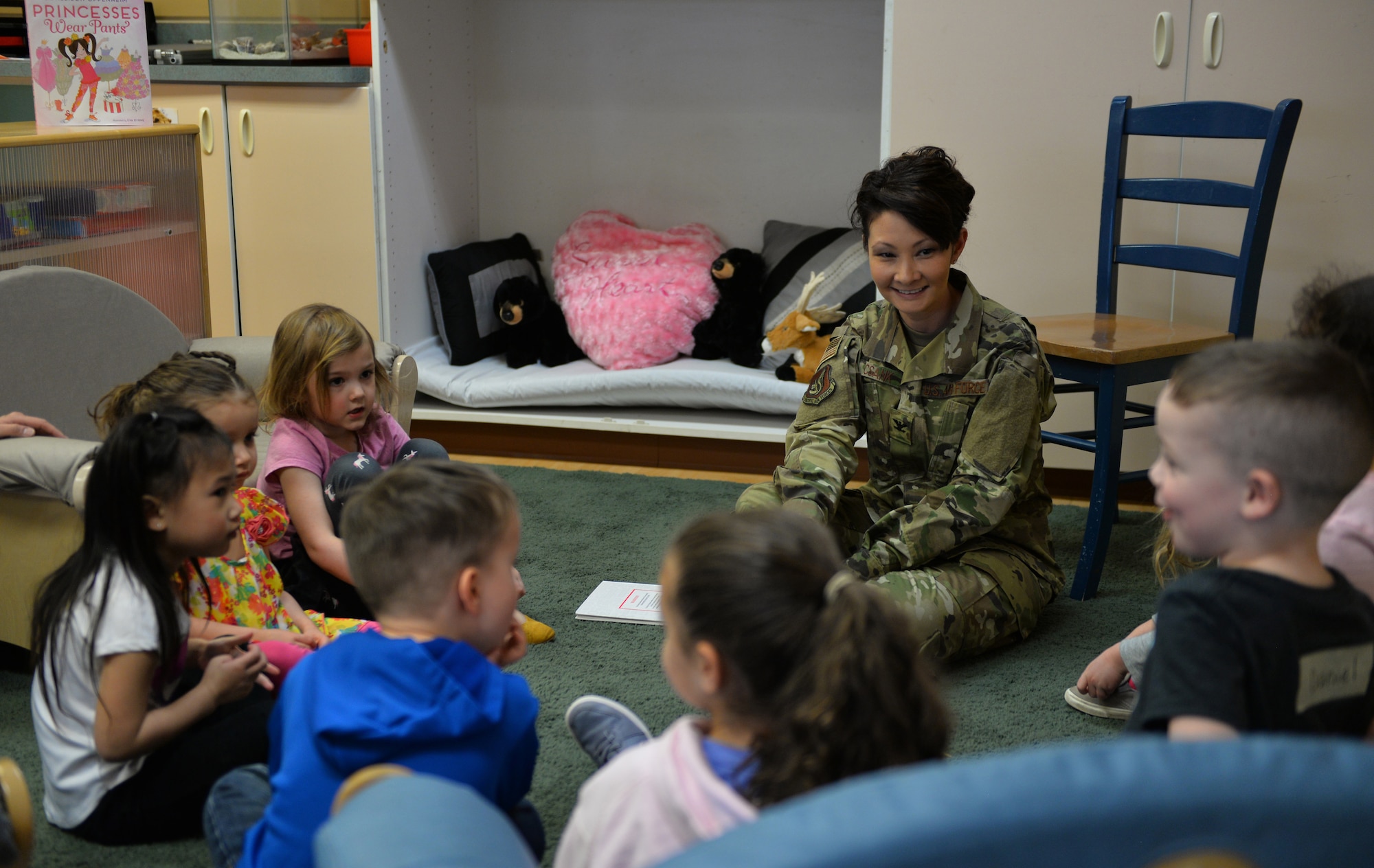 U.S. Air Force Col. Patricia Csànk, Joint Base Elmendorf-Richardson and 673d Air Base Wing commander, interacts with kids at the Denali Child Development Center, JBER, Alaska, April 8, 2019. In honor of Month of the Military Child, Csànk visited the Denali Child Development Center at JBER to read to some of the children. Out the selection of four books, the kids elected to read “The Book With No Pictures,” by B.J. Novak, knowing all too well what this piece of literature would have Csànk reading aloud.