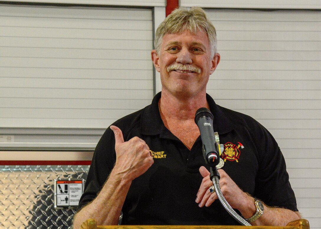 KIRTLAND AIR FORCE BASE, N.M. -- Kirtland Air Force Base Fire Chief Darryl Stewart bids farewell to his fellow firefighters, mission partners and members of the 377th Mission Support Group during a ceremony April 16, 2019 at Fire Station 2 here. Stewart was presented with the Award for Meritorious Civilian Service and given gifts by his department, security forces, LRS and EOD. (U.S. Air Force photo by Jessie Perkins)