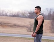 U.S. Air Force 1st Lt. Jeremy E. Garcia, a 35th Fighter Wing public affairs officer, looks out into the field, ready to begin his morning run. Garcia began running to initially lose weight, but discovered it helped him become a more resilient Airman. He took on the challenge to help develop a mental edge when it came to dealing with adversity. (U.S. Air Force photo by Staff Sgt. Brittany A. Chase)