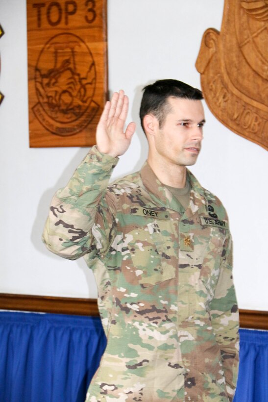 Maj. Taylor Oney recites the Oath of Office during his promotion ceremony from captain to major.