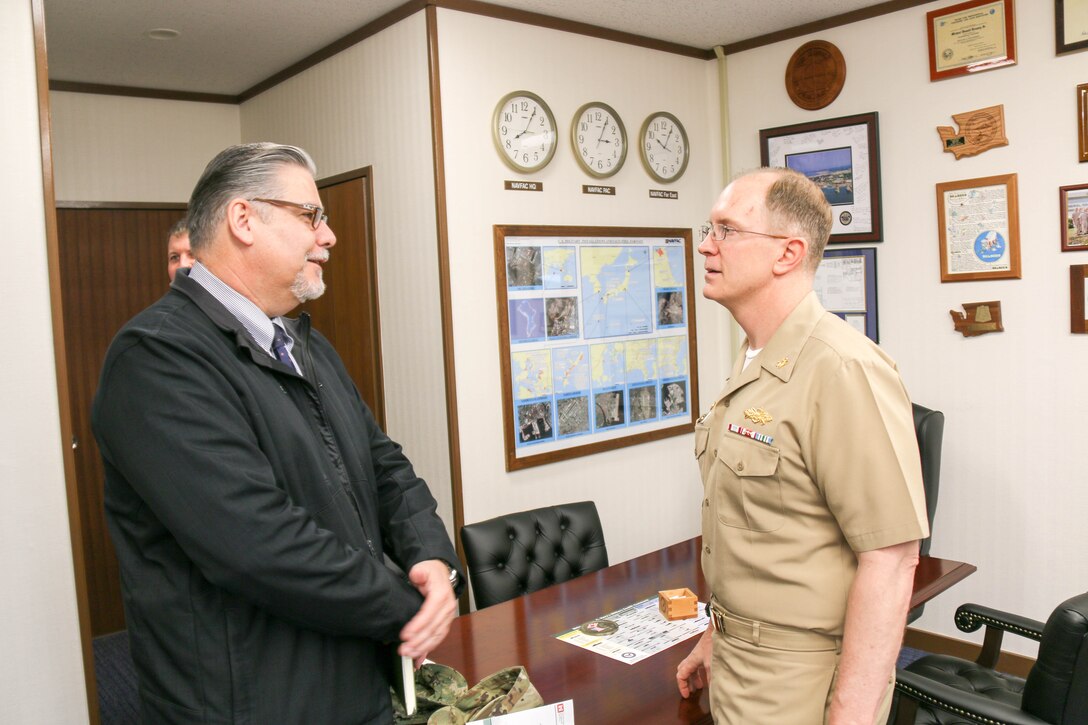 Pacific Ocean Division SES Damon Lilly speaks with Naval Facilities Far East Commander Capt. Michael D. Kenney Jr.