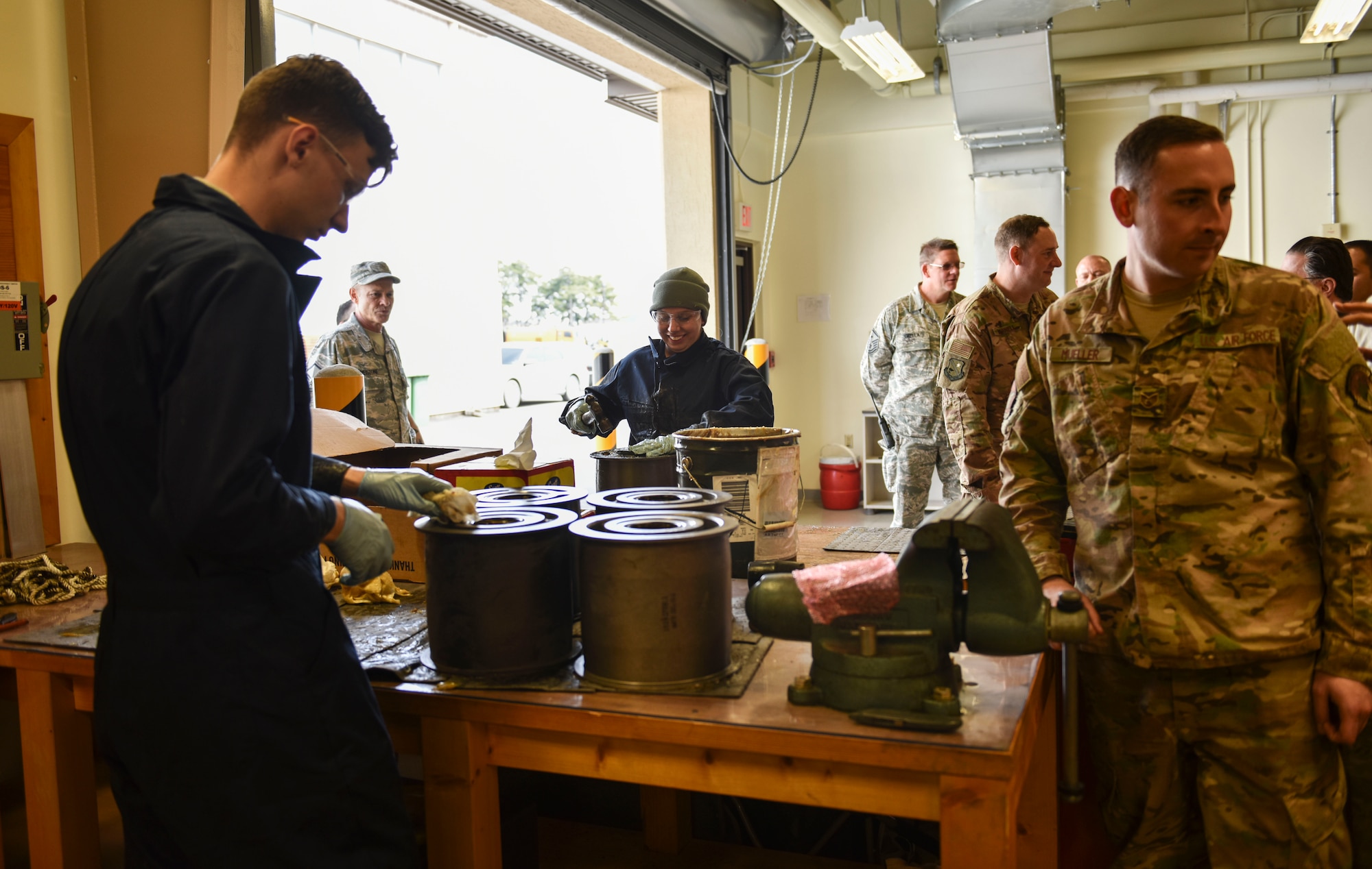 Members from the 176th Civil Engineer Squadron, Joint Base Elmendorf-Richardson, Alaska, perform maintenance on aircraft arresting system components at Kunsan Air Base, Republic of Korea, April 17, 2019. The 176th CES sent members on a training deployment to gain experience performing tasks they normally wouldn’t have an opportunity to back at home station. (U.S. Air Force photo by Senior Airman Stefan Alvarez)