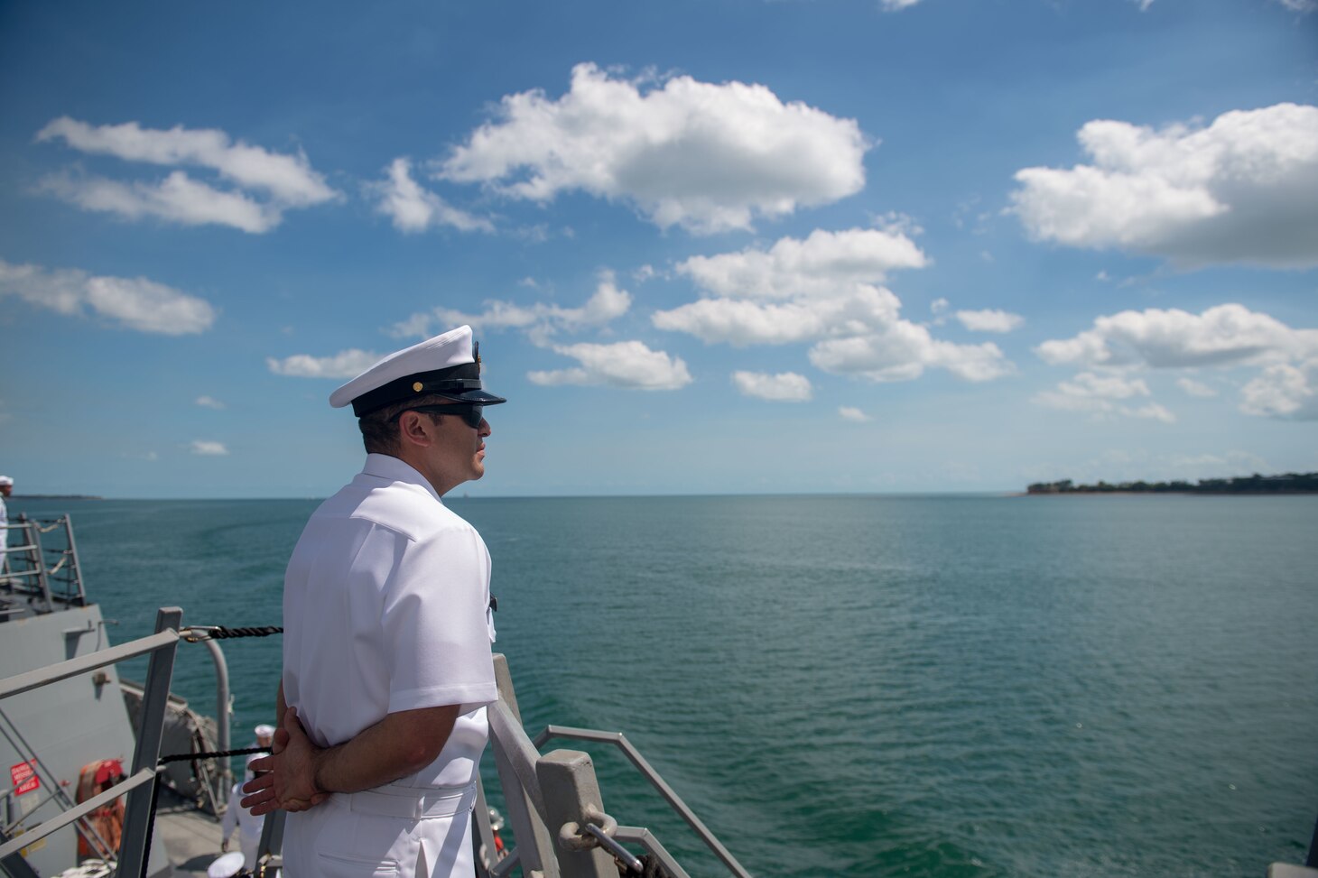 U.S. Navy Chief Cryptologic Technician (Technical) Gabriel Villanueva, from Hyattsville, Maryland, mans the rails of the guided-missile destroyer USS Stockdale (DDG 106), as the Stockdale pulls into Darwin, Australia, for a port visit, April 17, 2019. The Stockdale is deployed to the U.S. 7th Fleet area of operations in support of security and stability in the Indo-Pacific region.
