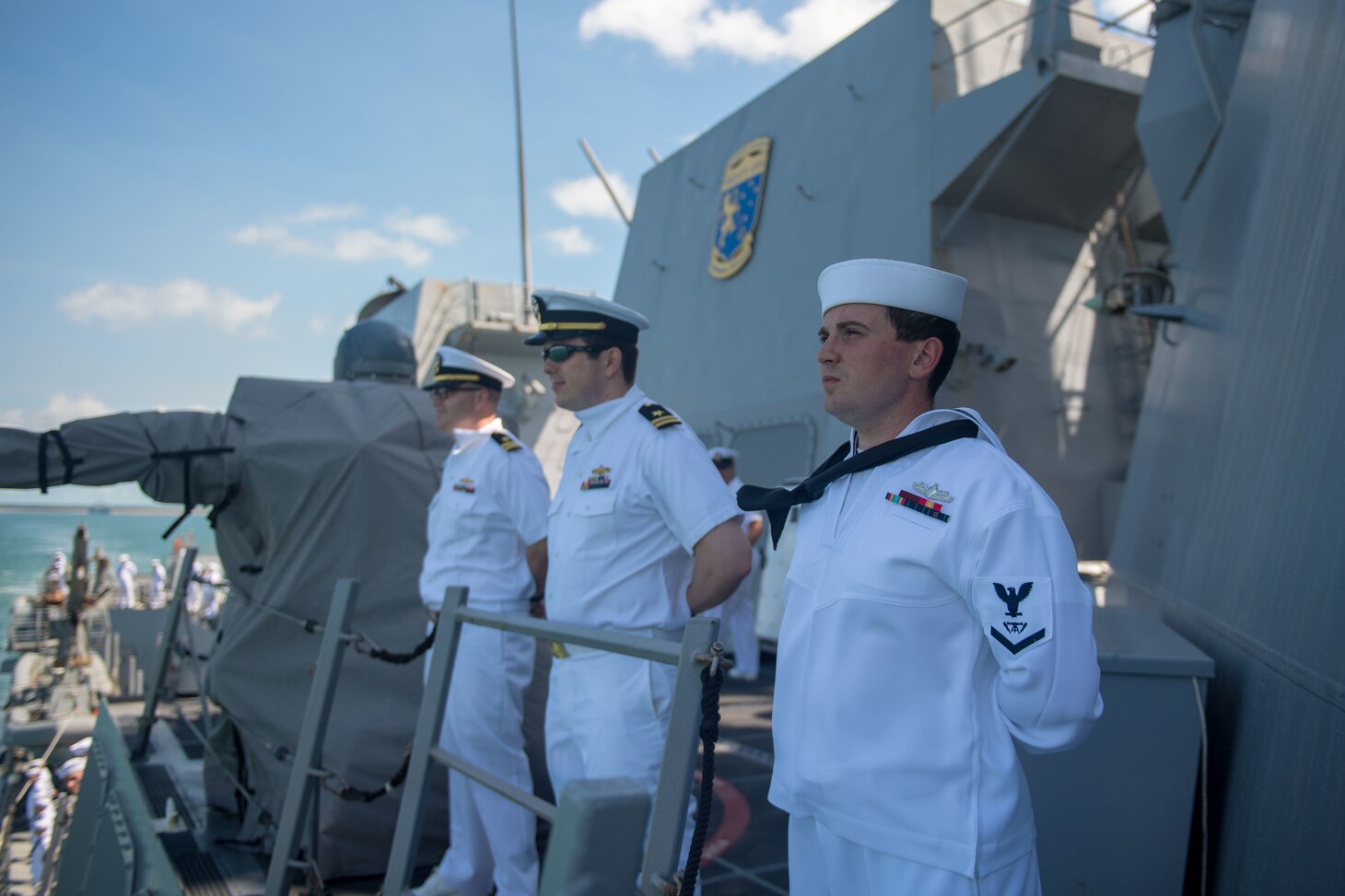 U.S. Navy Fire Controlman (Aegis) 3rd Class Benjamin Hitt, from Decatur, Alabama, mans the rails of the guided-missile destroyer USS Stockdale (DDG 106), as the Stockdale pulls into Darwin, Australia, for a port visit, April 17, 2019. The Stockdale is deployed to the U.S. 7th Fleet area of operations in support of security and stability in the Indo-Pacific region.