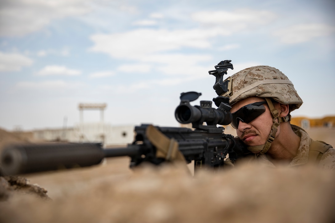 U.S. Marine Lance Cpl. Mason Morales, a designated marksman with the 22nd Marine Expeditionary Unit, provides security with an M27 Infantry Automatic Rifle in a simulated embassy compound as part of embassy reinforcement training during MEU exercise. The training sharpens Marines’ skills and prepares the 22nd MEU to deploy at a moment’s notice. Marines and Sailors with the 22nd MEU and Kearsarge Amphibious Ready Group are currently deployed to the U.S. 5th Fleet area of operations in support of naval operations to ensure maritime stability and security in the Central region, connecting the Mediterranean and the Pacific through the western Indian Ocean and three strategic choke points.