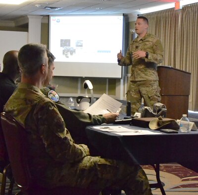 Members of the panel listen as Capt. Jared Evans, 552nd Training Group, introduces Immersive Media Training on April 15, 2019. Evans and Capt. Anthony Cummings, 552nd TRG were one of the winning ideas of the first 552nd Air Control Wing Spark Tank event. (U.S. Air Force photo/2nd Lt. Ashlyn K. Paulson).