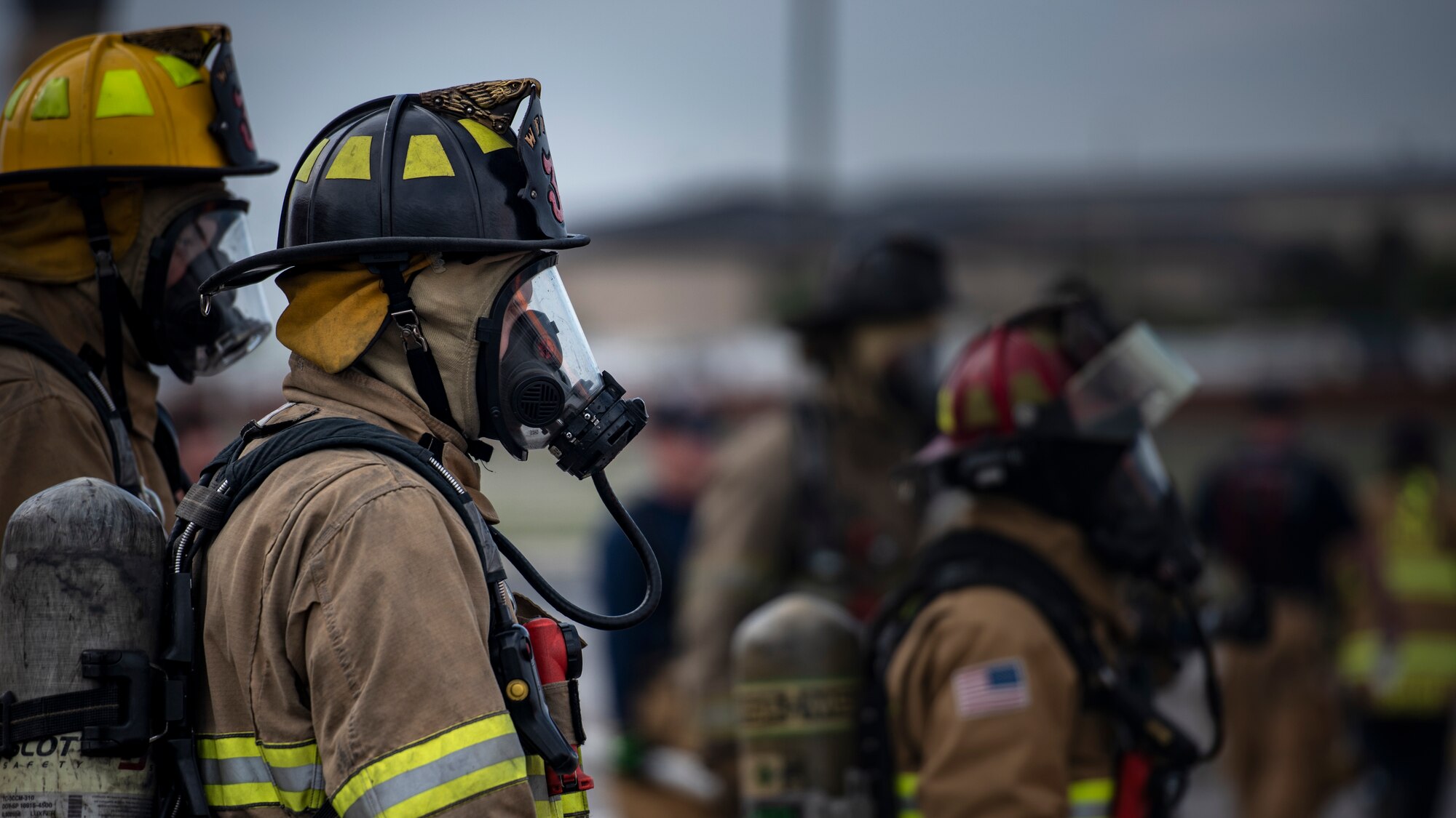 Sheppard Air Force Base firefighters rush to put a fire out at Sheppard AFB, Texas, April 17, 2018. The department conducts frequent training sessions to refresh different proficiencies required of firefighters including battling exterior and interior aircraft fires as well as engine fires. (U.S. Air Force photo by Airman 1st Class Pedro Tenorio)