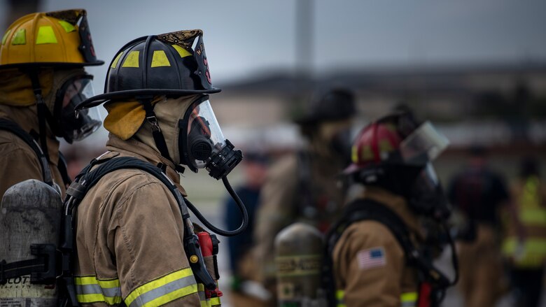 Sheppard Air Force Base firefighters rush to put a fire out at Sheppard AFB, Texas, April 17, 2018. The department conducts frequent training sessions to refresh different proficiencies required of firefighters including battling exterior and interior aircraft fires as well as engine fires. (U.S. Air Force photo by Airman 1st Class Pedro Tenorio)