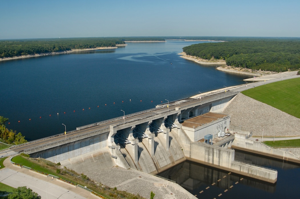 Clarence Cannon Dam is a 138 feet (42 m) high and 1,940 feet (590 m) long combination concrete gravity embankment dam. The dam contains 450,000 cubic yards (340,000 m3) of concrete and 3,000,000 cubic yards (2,300,000 m3) of earth-fill. The dam contains a hydroelectric power plant, with two generators, capable of producing up to 58 megawatts (78,000 hp) of power, or enough to supply a town of 20,000 people. When both units are operating at capacity, as much as 5,400,000 US gallons (20,000,000 l; 4,500,000 imp gal) of water pass through the turbines each minute.
