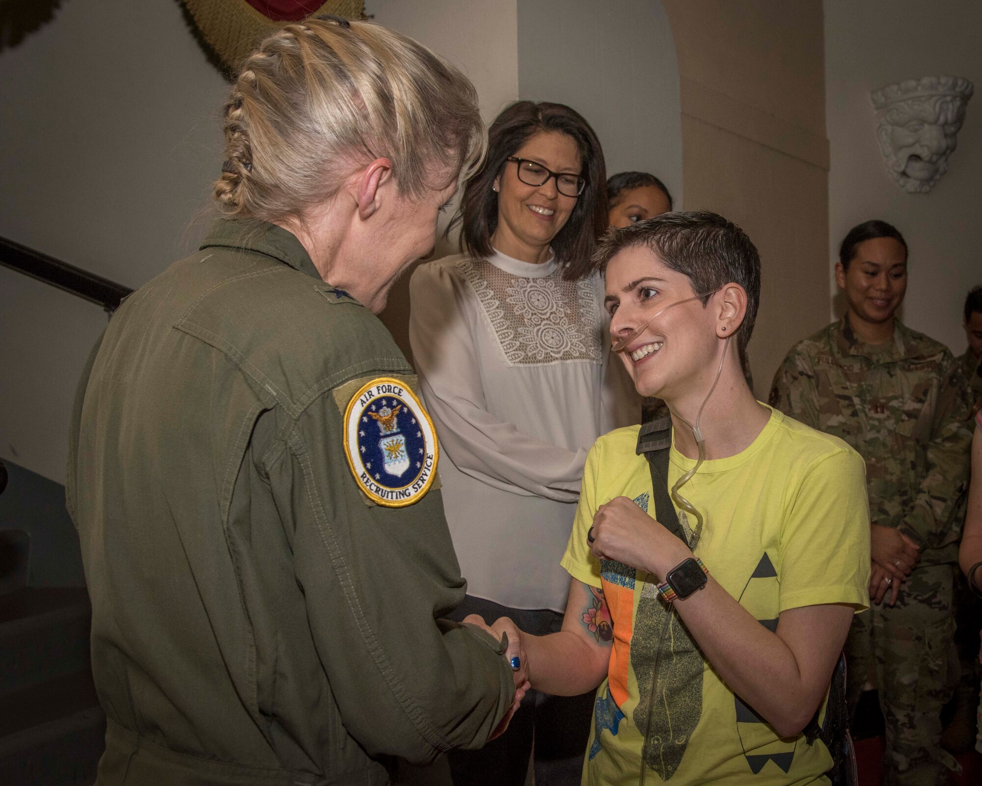 Alicia Figiuolo, U.S. Marine Corps veteran, shakes the hand of Brig. Gen. Jeannie Leavitt, commander of Air Force Recruiting Service, April 10, 2019, in the Fleenor Auditorium, Joint Base San Antonio-Randolph. The purpose of this event was to provide an opportunity for the JBSA community to hear, ask questions and learn from a leader like Brig. Gen. Leavitt as she shares her story as the first female fighter pilot and the first woman to command an Air Force combat fighter wing and talks about effective leadership practices in the Air Force. (U.S. Air Force photo by: Airman 1st Class Shelby Pruitt)