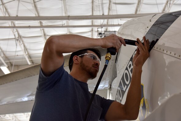 Hector Aldrete, a 47th Maintenance Directorate T-1A Jayhawk aircraft mechanic, installs an aircraft panel at Laughlin Air Force Base, Texas, April 11, 2019. Since the hail storm of 2016, the 47th MXD has recently reached their milestone of having 28 available T-1A Jayhawks for pilot training. (U.S. Air Force photo by Senior Airman John A. Crawford)