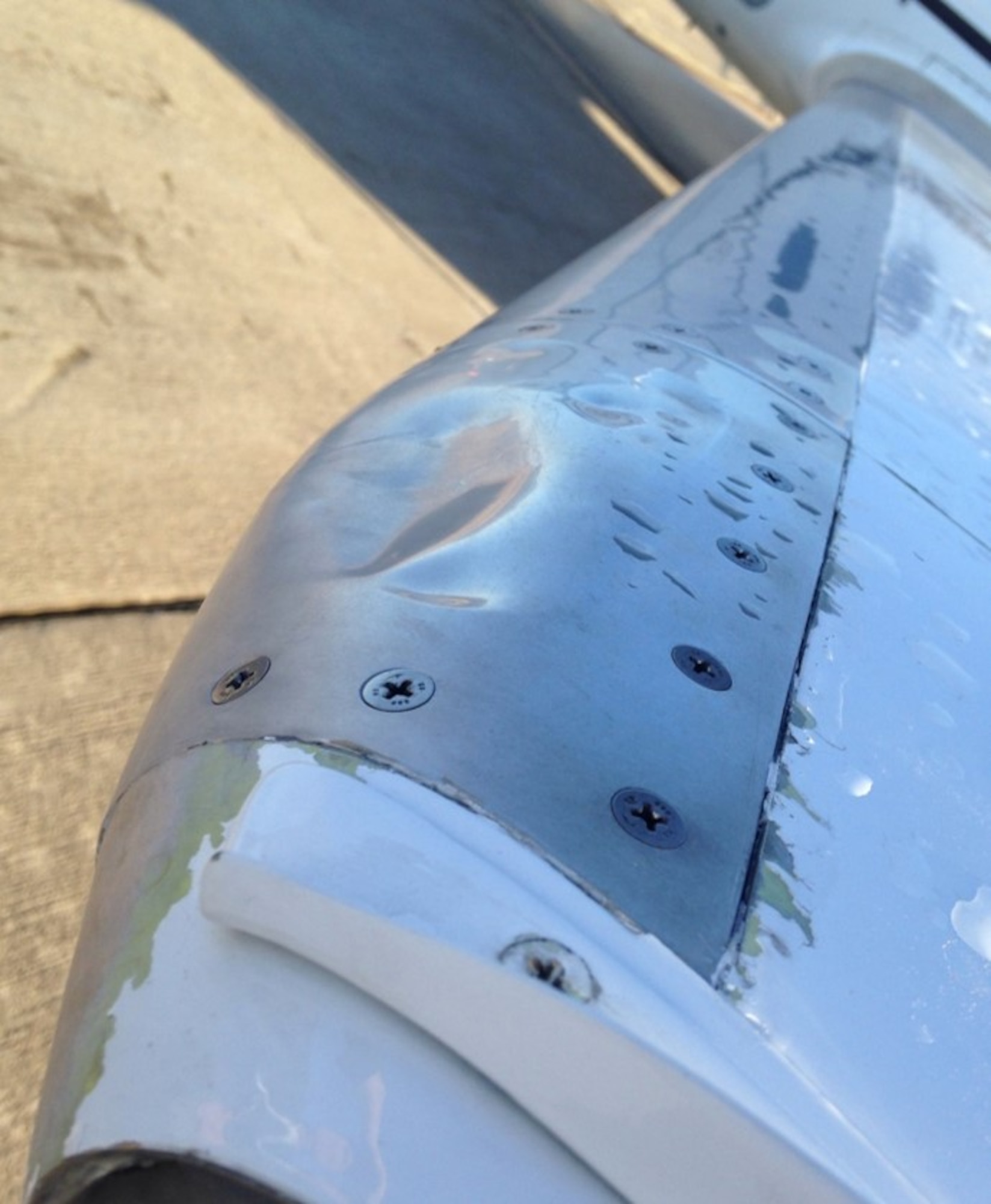 This wing demonstrates the extent of hail damage on a wing of a T-1A Jayhawk at the 47th Maintenance Directorate at Laughlin Air Force Base, Texas, Feb. 23, 2016. The hail storm that struck Laughlin brought with it 70 mph winds and hail as large as one and a half inches in diameter. (Courtesy photo)