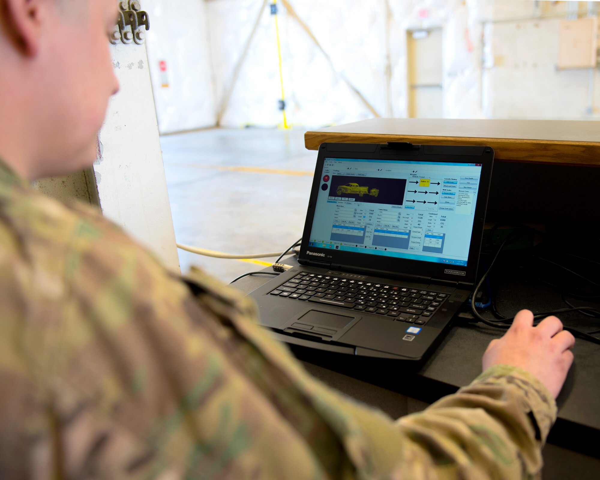 Tech. Sgt. Eric Reising, 92nd Logistics Readiness Squadron small air terminal NCO in-charge, utilizes the newly implemented Weigh-In-Motion scale to expedite cargo deployment functions with a more accurate and efficient process at Fairchild Air Force Base, Washington, April 17, 2019. The WIM scale saves countless man hours by collecting necessary data all at once through an advanced system of sensors, dynamic measurement system and data archiving, to name a few. (U.S. Air Force photo by Airman 1st Class Whitney Laine)