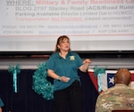 Shirley Herwig reviews the agenda for a stand down training event April 10 with uniformed and civilian members from contracting activities on Joint Base San Antonio-Fort Sam Houston as part of Sexual Assault and Prevention Awareness Month. Herwig is the Sexual Harassment/Assault Response and Prevention manager for the Mission and Installation Contracting Command.