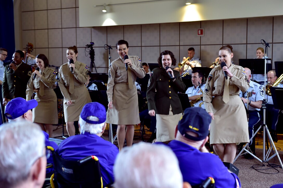 Members of the U.S. Air Force Concert Band and Singing Sergeants perform for an audience of military veterans during the DFW Honor Flight concert, at Joint Base Anacostia-Bolling, April 13, 2019. The concert honored military veterans from WWII, Vietnam and Korean War by playing music from the era. (U.S. Air Force photo by Staff Sgt. Cary Smith)