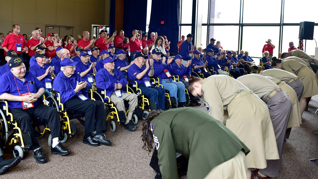 Members of the U.S. Air Force Singing Sergeants bow before an audience of military veterans during the DFW Honor Flight concert, at Joint Base Anacostia-Bolling, April 13, 2019. The concert honored military veterans from WWII, Vietnam and Korean War by playing music from the era. (U.S. Air Force photo by Staff Sgt. Cary Smith)